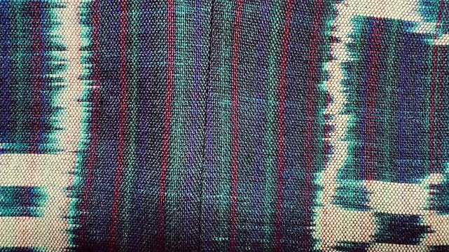 Handwoven ikat textile featuring colorful geometric patterns. Perfect for backgrounds, fashion, interior design, and cultural themes.