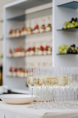 Elegant champagne glasses and canapes setup for stylish wedding or corporate event