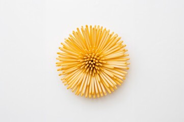 Yellow blossom crafted from toothpicks on a plain white backdrop