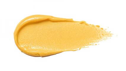 Yellow cosmetic cream sample spread on white backdrop