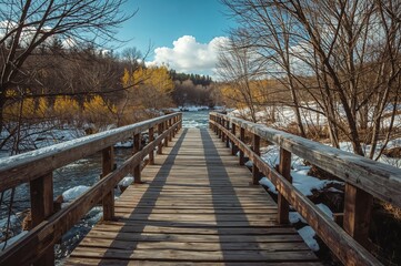 Naklejka premium Sunlit wooden footbridge during wintertime