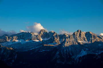Fototapeta premium Dolomites mountains, Alpi Dolomiti beautiful scenic landscape in summer. Italian Alps mountain summits and rocky tower peaks above green valley alpine scene near Cortina'd'Amprezzo