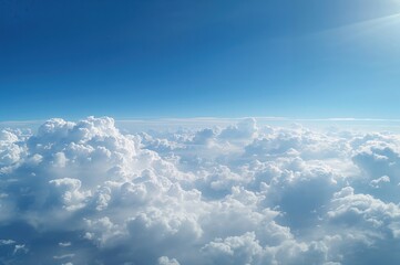 Expansive puffy clouds floating in a bright azure sky. Gentle white cloud formations. Created with generative AI technology.