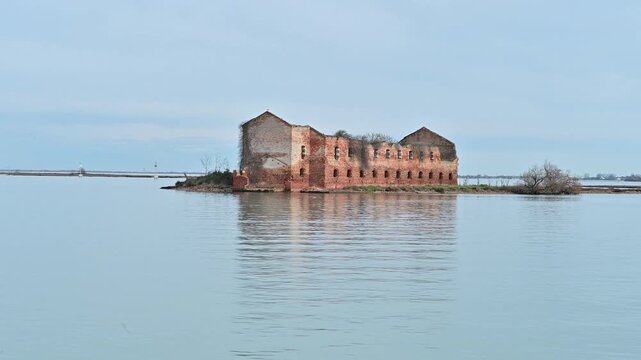 Old brick ruins of the Madonna del Monte convent monastery in Venetian Lagoon near Burano and Torcello island, Venice, Italy,  the problem of rising sea levels
