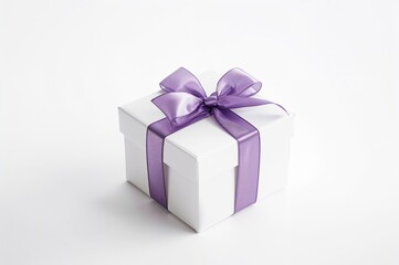 Obraz premium Purple ribbon bow on a white present box against a white backdrop