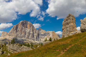 Dolomites mountains, Alpi Dolomiti beautiful scenic landscape in summer. Italian Alps mountain summits and rocky tower peaks above green valley alpine scene near Cortina'd'Amprezzo