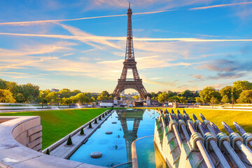 Beautiful sunset view of Eiffel Tower and Trocadero Gardens Fountain, Paris, France