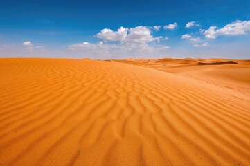 Rippling texture of orange desert sand
