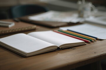 Educational materials arranged on a wooden table.