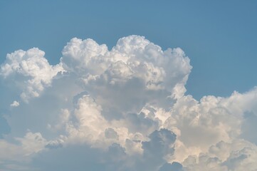 Blue sky filled with soft white clouds