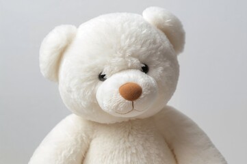 Plush white bear toy filled with stuffing