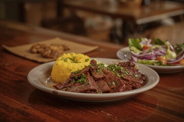 Authentic sun-dried beef served with manioc, a classic dish from Brazil