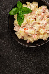 Potato salad ham, potato, tomato, carrot, mayonnaise tasty snack fresh delicious gourmet food background on the table rustic top view copy space