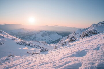 Bright snowy conditions atop a mountain in the heart of the region
