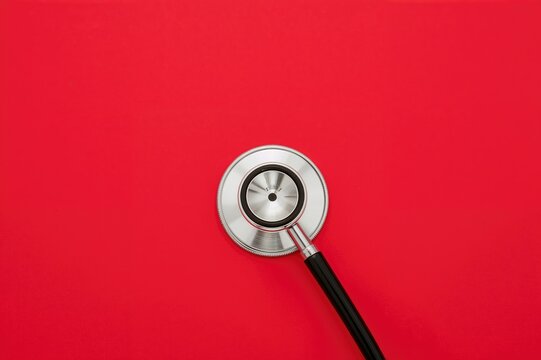 Red heart with stethoscope symbolizes cardiovascular wellness, medical coverage, and awareness events for healthcare professionals and high blood pressure.