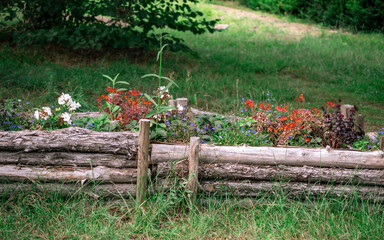 Flower Bed with Log Border and Assorted Flowers
