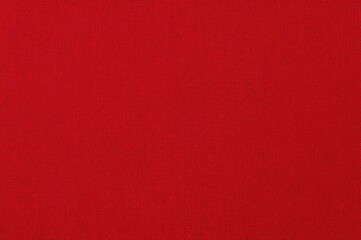 Fototapeta premium Close-up of red natural fabric texture made from cotton or linen, ideal for upholstery and decoration