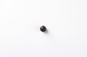 Isolated Black Chickpeas on a White Surface