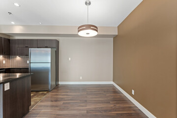 Kitchen with a refrigerator and a sink