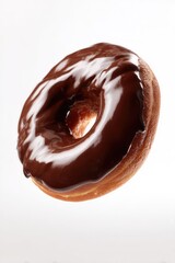 Donut with chocolate glaze isolated on white background. Round American chocolate doughnut. Homemade bakery