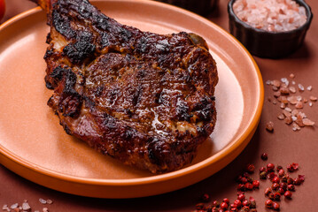 Grilled bone-in meat, beef tomahawk steak, juicy barbecued meat. Tomahawk steak