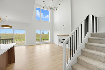 Large open living room with a fireplace and a staircase