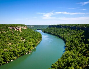 River winding through lush green valley under a vibrant blue sky