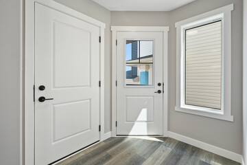 White door with a window in the middle