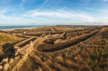 Take in the stunning view of historic landing beaches from a scenic lookout in a coastal town in northern France.
