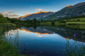 Fototapeta premium A tranquil lake surrounded by hills