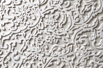 Close-up of intricate white Arabic geometric design on wall