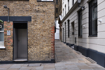 14 Sep 2025 - London\UK : Brown brick wall by alleyway