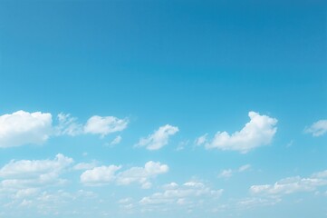Obraz premium Bright Blue Sky Featuring White Clouds and Empty Area