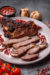 Grilled bone-in meat, beef tomahawk steak, juicy barbecued meat. Tomahawk steak