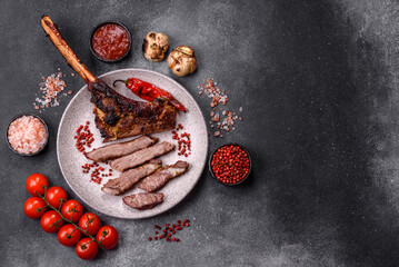 Grilled bone-in meat, beef tomahawk steak, juicy barbecued meat. Tomahawk steak