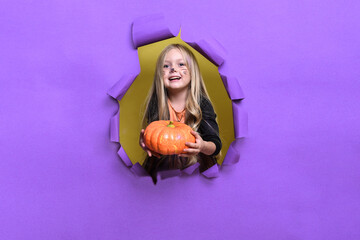 Girl with Halloween pumpkin, studio