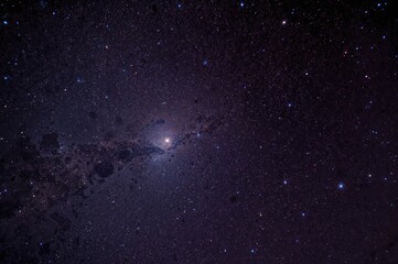Fototapeta premium Celestial scene featuring a comet, star clusters, cosmic dust, and the Milky Way captured through a specialized astrophotography telescope.