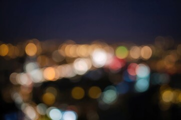 Blurred colorful city lights against a dark backdrop for abstract wallpaper design