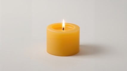 Lone candle in yellow and brown hues against a white backdrop