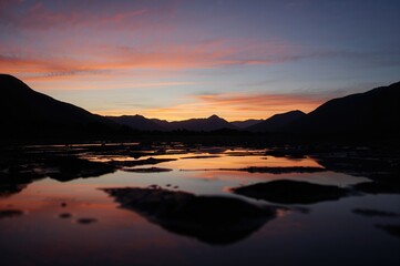 Fototapeta premium Mountain range sunset silhouette scene