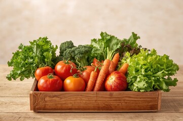 Assortment of vibrant fresh produce displayed in a wooden container on a bright surface
