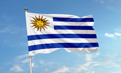 Uruguayan flag with sun symbol flying in sky