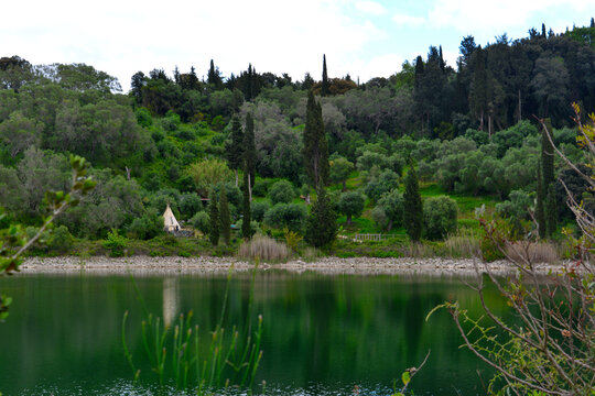 Mischopoulos Man-made Lake is a hidden gem nestled in the wilderness, making it an ideal spot for a short hike and nature lovers. Corfu Island, Greece.
