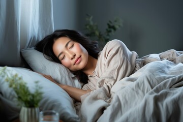 Woman sleeping peacefully in cozy bedroom light