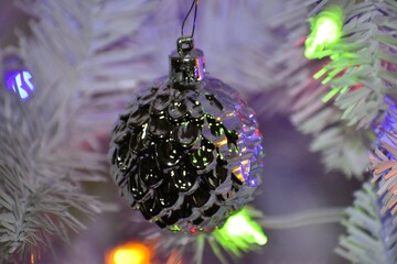 Silver Textured Ornament on White Christmas Tree