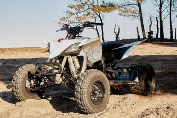 Quadricycle on the sand