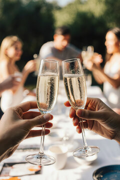Hand holding glass of champagne, people cheering, friends, party nightclub, wedding, cheering, family, sparkling wine, luxury, social media, insta story, 9:16, 4K