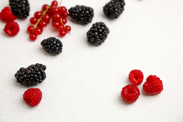 Fresh berries arranged on a countertop with a minimalist aesthetic during daylight
