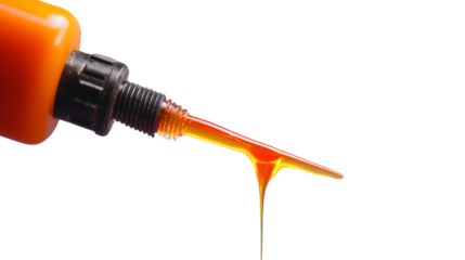 Vibrant Orange Liquid Pouring from a Bottle with Professional Detail
