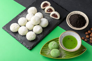 Delicate Japanese Mochi with Filling on Slate and Green Background